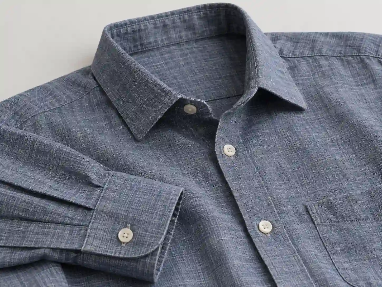 Custom woven long-sleeve shirt showing collar, placket, cuff and fabric detail