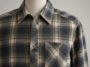 Close-up of a custom plaid shirt showing aligned checks across the chest pocket and center-front placket