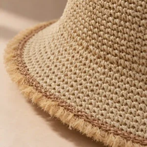 Close-up of woven paper straw texture on a foldable bucket hat